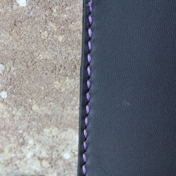 minimalist black chrome tan leather wallet with purple stitching