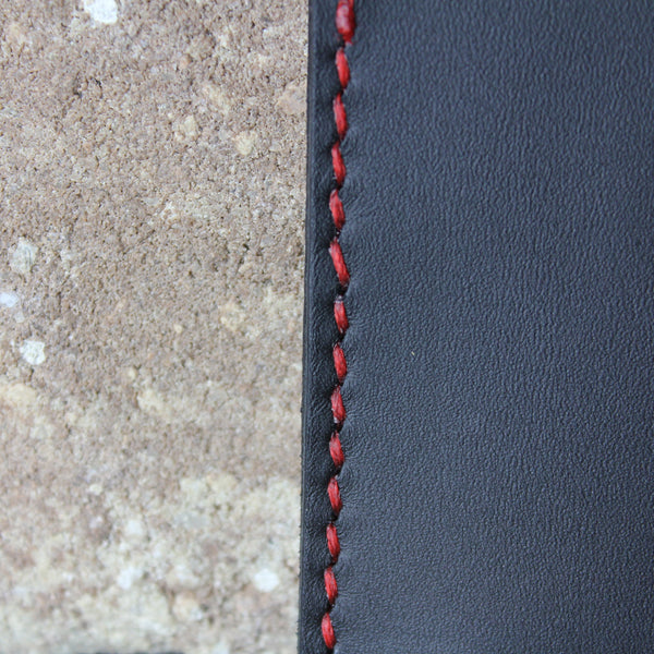 minimalist black chrome tan leather wallet with red stitching